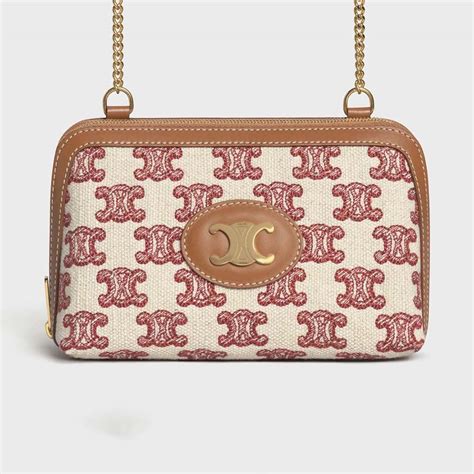 Women's Clutch with chain in Triomphe canvas and lambskin.